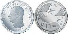 Монета с профилем короля Испании и голубем