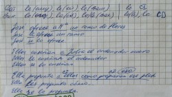Записи на клетчатой бумаге с испанским текстом